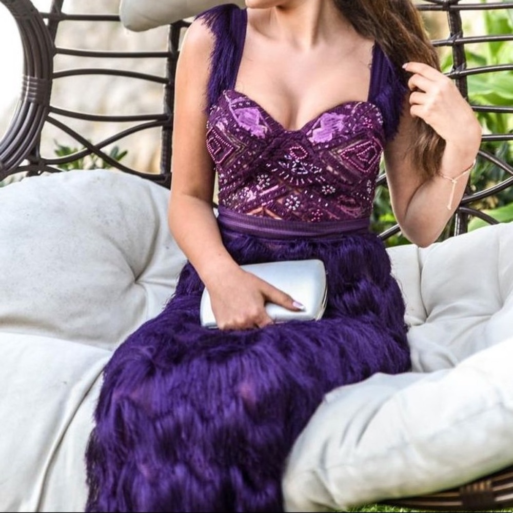 A handmade wedding/prom dress in size small and dark purple color.